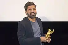 Director Bardroy Barretto receiving his Grand Prix for the film "Let's dance to the Rhythm" at the VIFF 2016