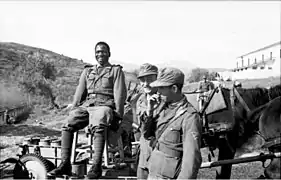 Three German Second World War soldiers, two wearing forage caps