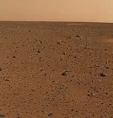 First color picture from Gusev crater. Rocks were found to be basalt. Everything was covered with a fine dust that Spirit determined was magnetic because of the mineral magnetite.