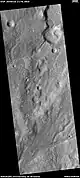 Channels with one leading to a lake  This image was named HiRISE picture of the day.