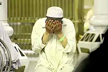 Raising hands in Dua.